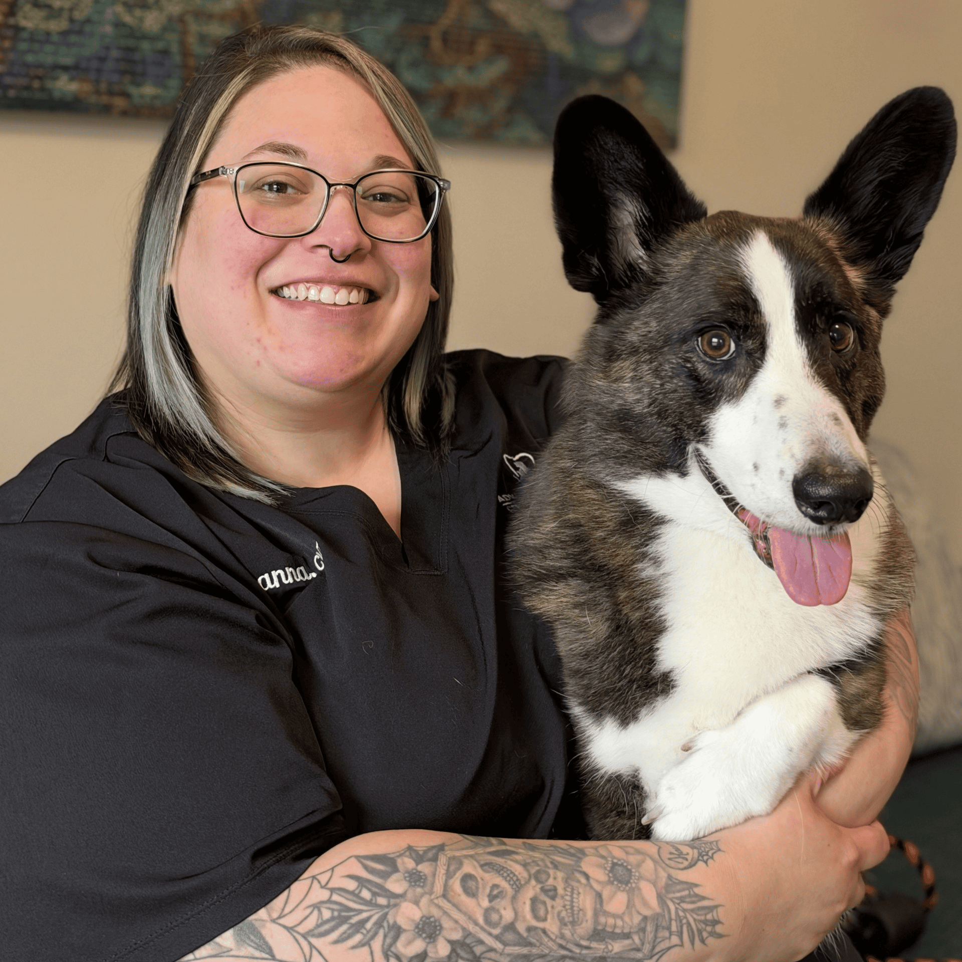 Arianna smiling with a dog