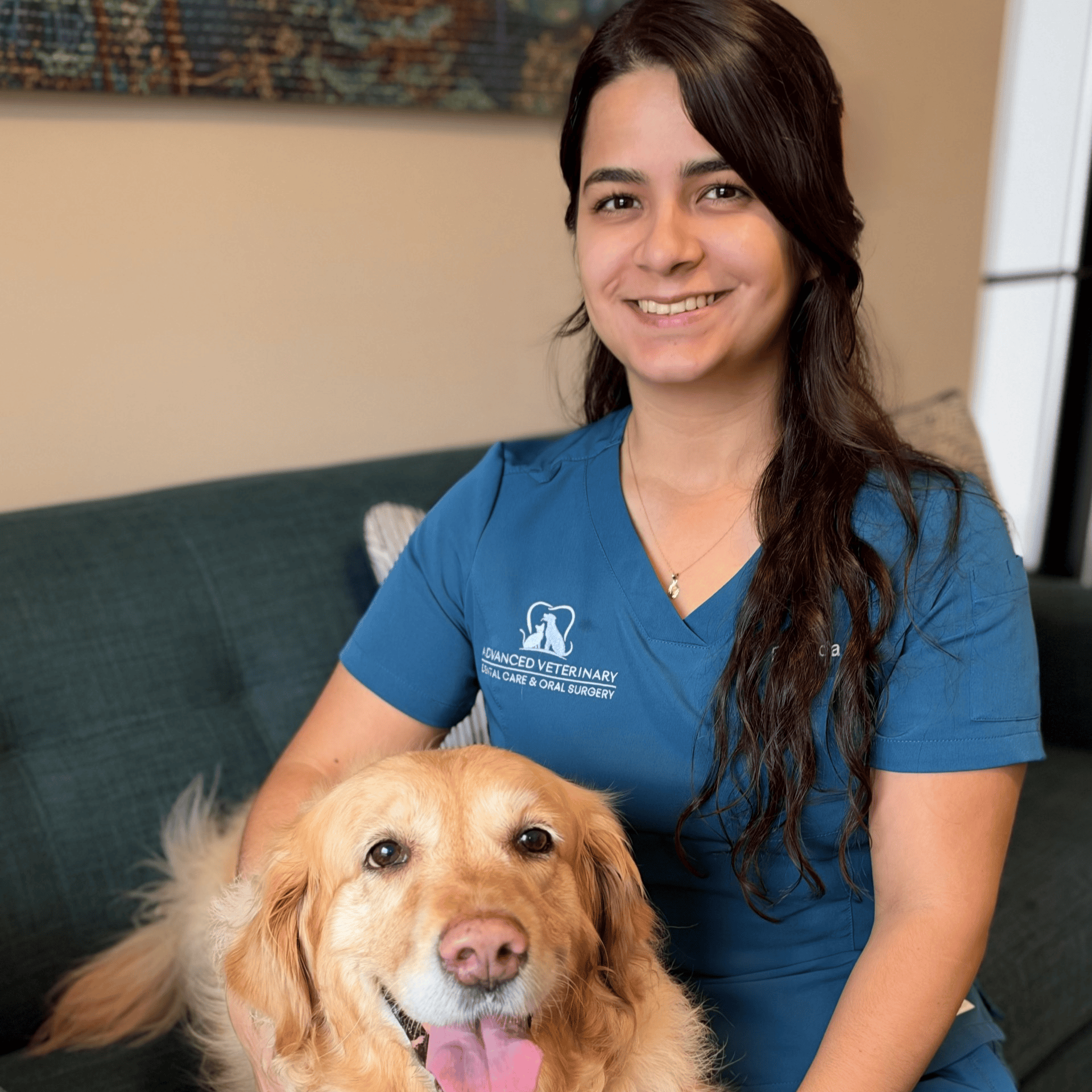 Brenda smiling with a dog